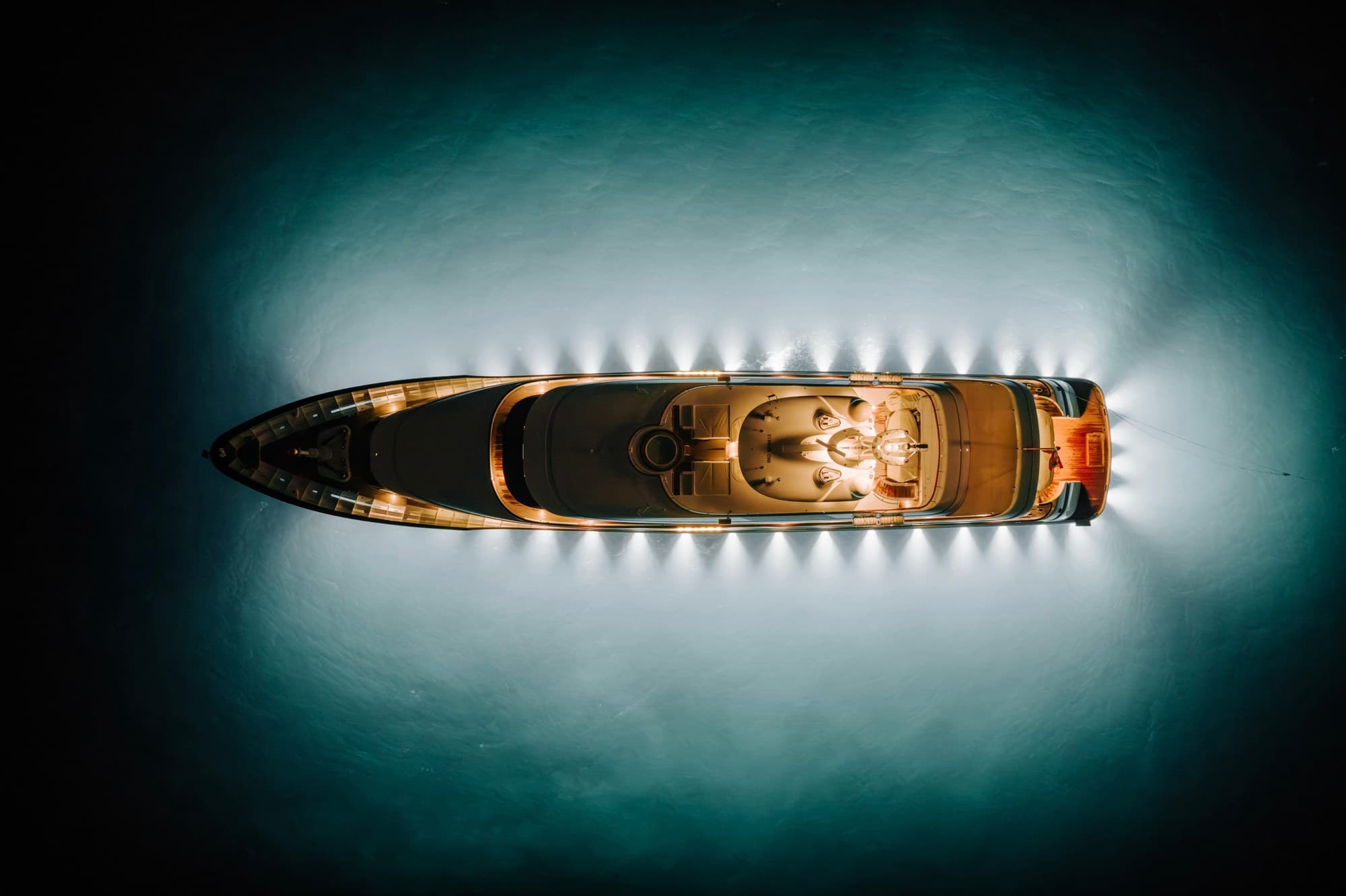 Superyacht aglow at night